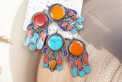 Silver Plated Tibetan Hamsa pendants.